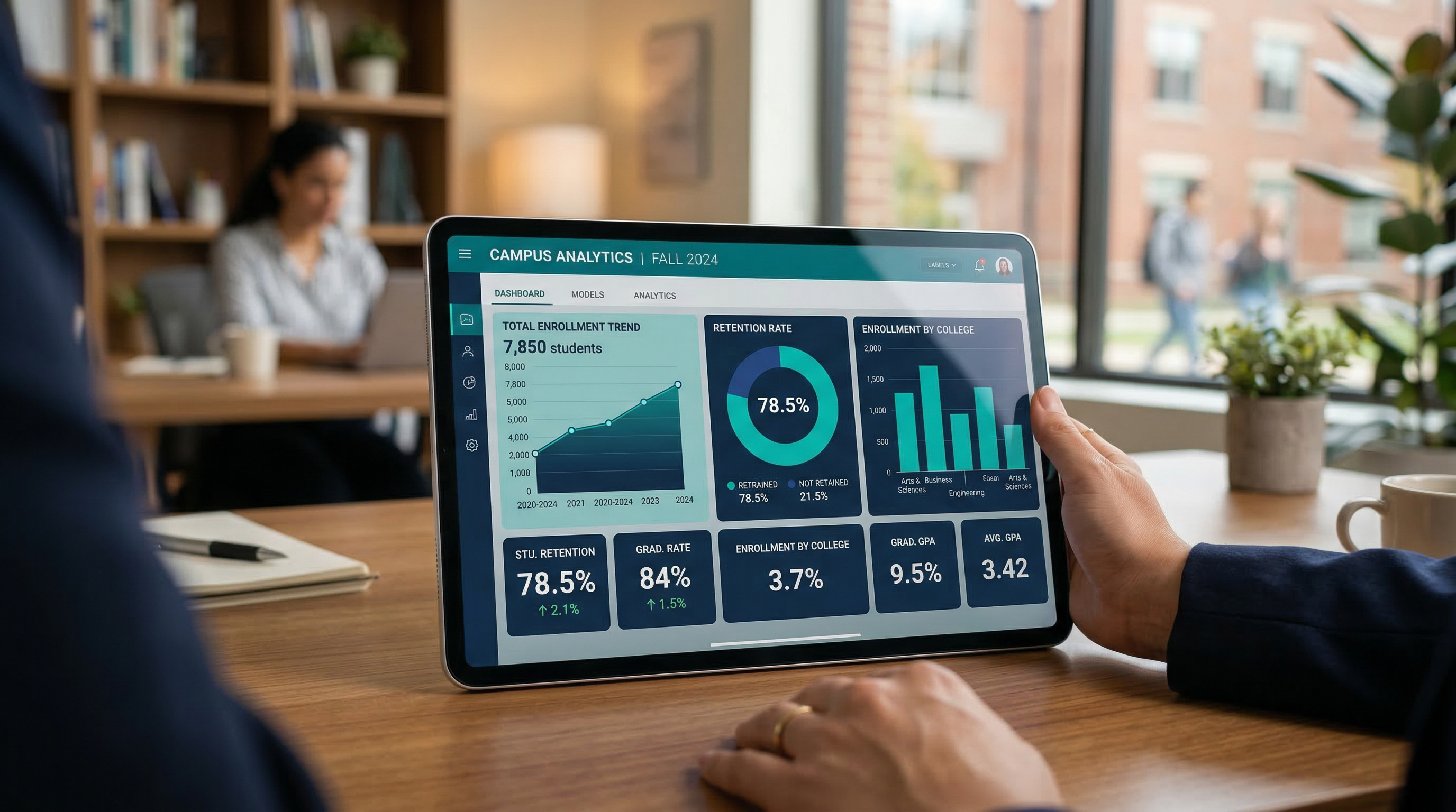 Analytics dashboard on a tablet showing enrollment and retention metrics